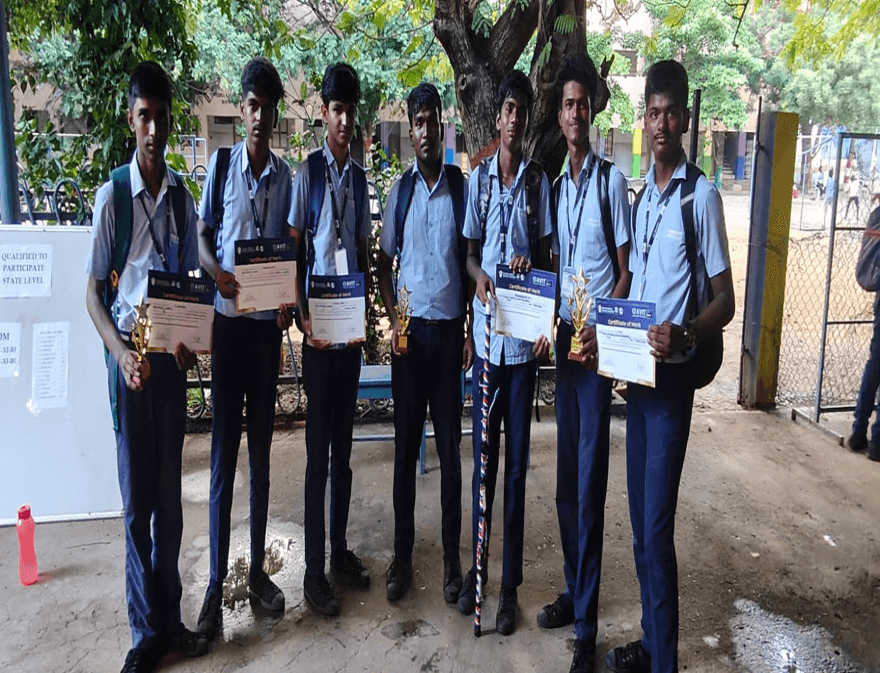 BKMHSS students displaying certificates won at a competition