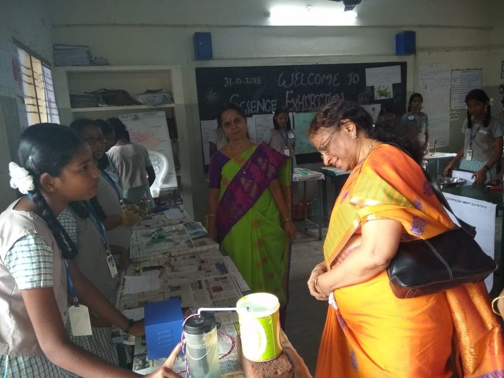 A student presenting a project at the school science exhibition