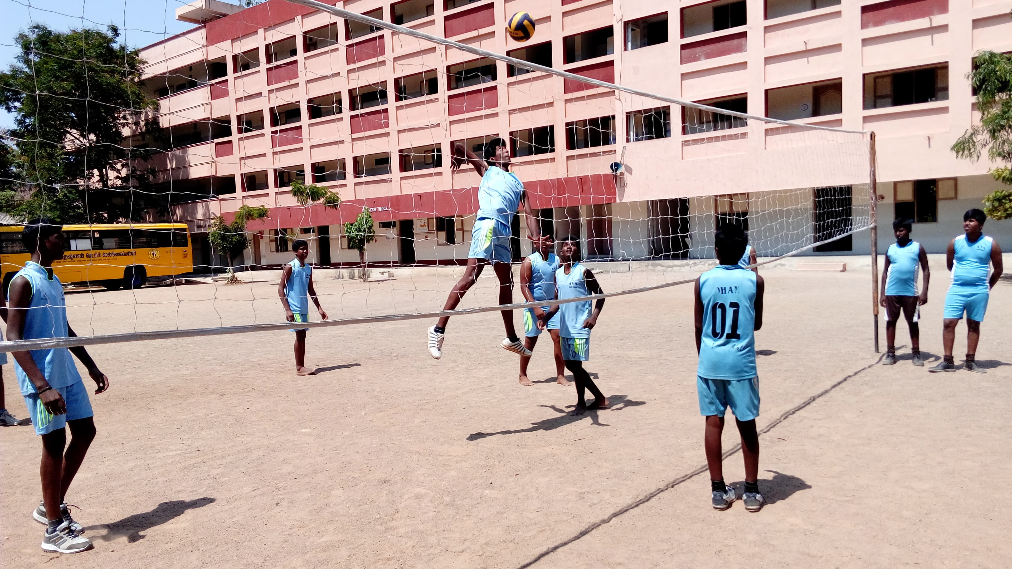Students playing football on the BKMHSS playground